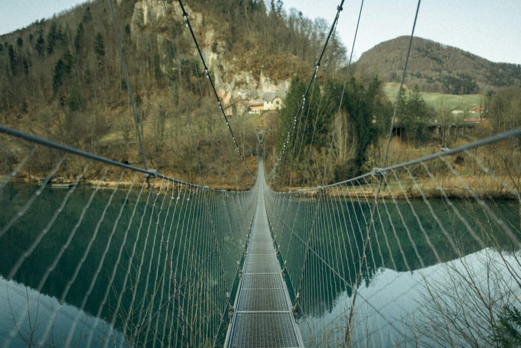 green and white bridge over river